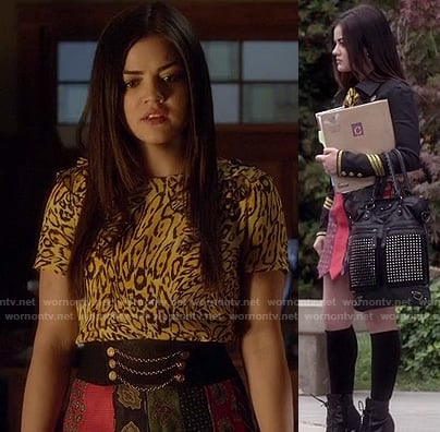 Aria’s patchwork/neck tie skirt with yellow cheetah print top, military style blazer and black studded bag on Pretty Little Liars