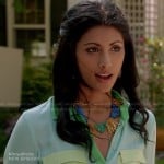 Divya’s pastel colorblock shirt and blue spike necklace on Royal Pains