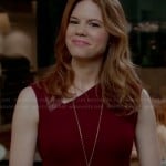 Peri’s burgundy red dress with leather detail and asymmetric neckline on Devious Maids