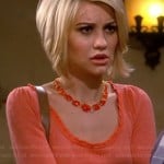 Riley’s orange top with fitted waist and orange necklace on Baby Daddy