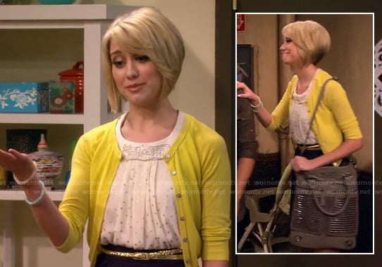 Riley's white and silver polka dot top with bow, yellow cardigan and grey studded shoulder bag on Baby Daddy