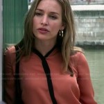 Annie’s orange shirt with black trim on Covert Affairs