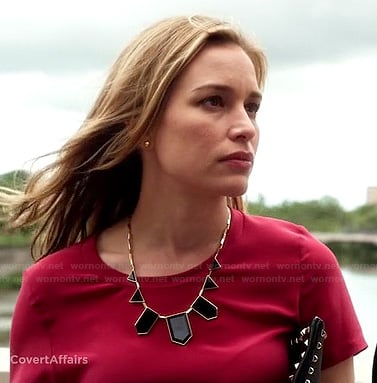 Annie's red top, black geometric necklace and studded clutch on Covert Affairs