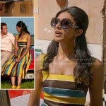 Divya’s blue, yellow and black striped dress and round sunglasses on Royal Pains