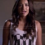 Emily’s white tank top with black striped heart graphic on Pretty Little Liars