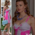 Paige’s pink abstract printed dress and blue satchel purse on Royal Pains