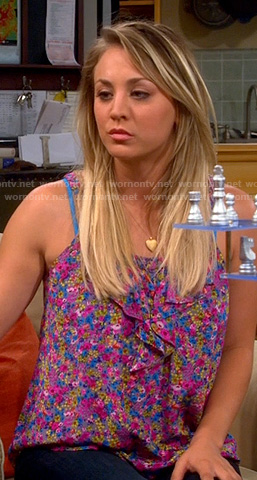 Penny’s pink and purple floral ruffle front top on The Big Bang Theory