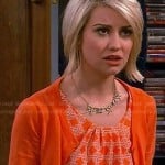 Riley’s orange geometric print top on Baby Daddy