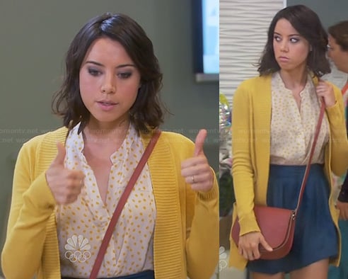 April's yellow dot print top, blue skirt and yellow cardigan on Parks and Recreation