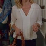 Claire’s white pleat front blouse on Modern Family