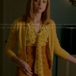 Emma’s yellow printed bow front blouse and high waisted button detail pencil skirt on Glee