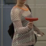 Eve’s beige knit sweater with orange neckline on Last Man Standing