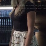 Felicity’s flared and patterned skirt and black top on Arrow