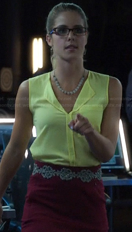 Felicity's yellow split neck top and burgundy skirt on Arrow