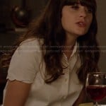 Jess’s white short sleeve shirt with scalloped sleeves on New Girl