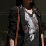 Joan’s black ram skull and snake graphic tee on Elementary