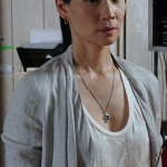 Joan’s white snake print tank top on Elementary