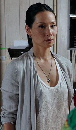 Joan's white snake print tank top on Elementary