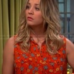 Penny’s orange floral sleeveless shirt on The Big Bang Theory