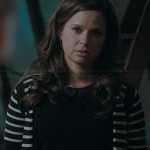 Quinns’ black top with leather collar and striped cardigan on Scandal