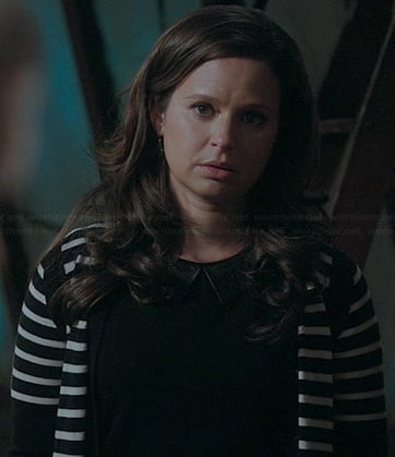 Quinns’ black top with leather collar and striped cardigan on Scandal