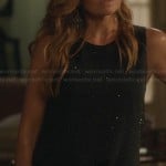 Rayna’s black rhinestone top and blue printed jeans on Nashville