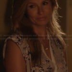 Rayna’s grey flower print blouse with white trim on Nashville