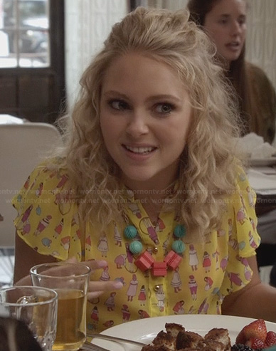 Carrie's yellow people-printed blouse on The Carrie Diaries