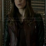 Cat’s burgundy leather jacket with black sleeves on Beauty and the Beast