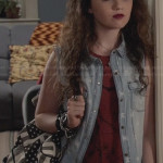 Dorrit’s denim skull print vest and flag backpack on The Carrie Diaries