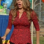 Gloria’s red snakeskin top with chain neckline on Modern Family