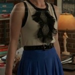 Margaux’s black and white ruffle front top and blue pleated skirt on Revenge