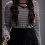 Olivia’s striped sweater and black lace skirt on Ravenswood