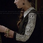 Olivia’s black sweater with white crochet sleeves and collar on Ravenswood