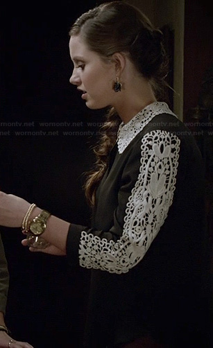 Olivia’s black sweater with white crochet sleeves and collar on Ravenswood