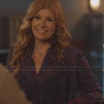 Rayna’s purple and red floral printed blouse with red ruffle collar on Nashville