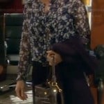 Vanessa’s blue floral blouse, elbow patch blazer and black bag on Last Man Standing