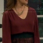 Vanessa’s red long sleeve blouse and tweed skirt on Last Man Standing