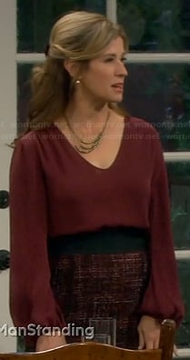 Vanessa's red long sleeve blouse and tweed skirt on Last Man Standing