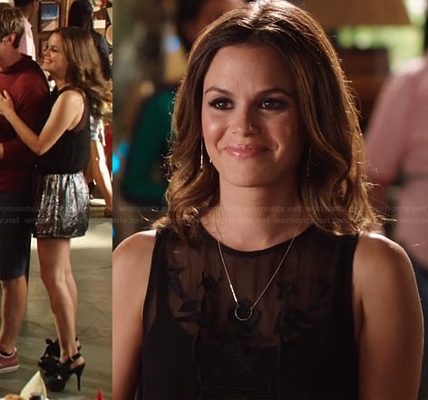 Zoe’s silver metallic shorts and sheer black embroidered top on Hart of Dixie