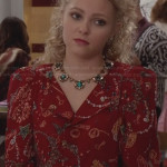 Carrie’s red printed jacket and green flower necklace on The Carrie Diaries
