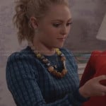 Carrie’s blue printed sweater and bead necklace on The Carrie Diaries