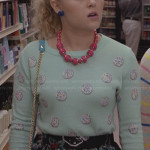 Carrie’s mint green polka dot sweater and black floral skirt on The Carrie Diaries