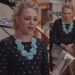 Carrie’s navy and turquoise polka dot sweater, flower necklace and graphic printed skirt on The Carrie Diaries