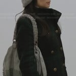 Joan’s green plaid coat and grey cable knit beanie on Elementary