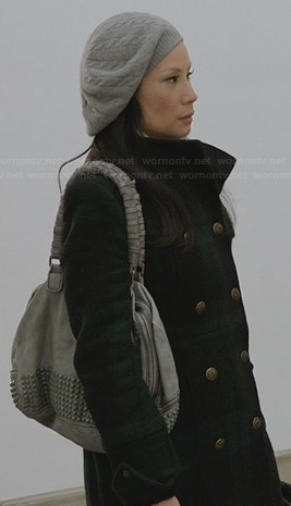 Joan’s green plaid coat and grey cable knit beanie on Elementary