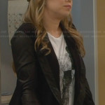 Kristin’s white graphic tee and black jacket with leather trim and sleeves on Last Man Standing