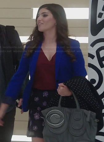 Lauren's blue blazer and floral skirt on The Crazy Ones