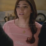 Lauren’s peach pink “Please Do Not Disturb” top on The Crazy Ones