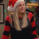 Penny’s black sweater with red striped sleeves and knitted Santa hat on The Big Bang Theory